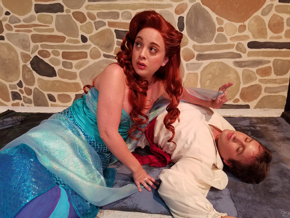 Ariel (Lyndsay Palmer) saves Prince Eric(Aaron Eberhardt) from drowning.